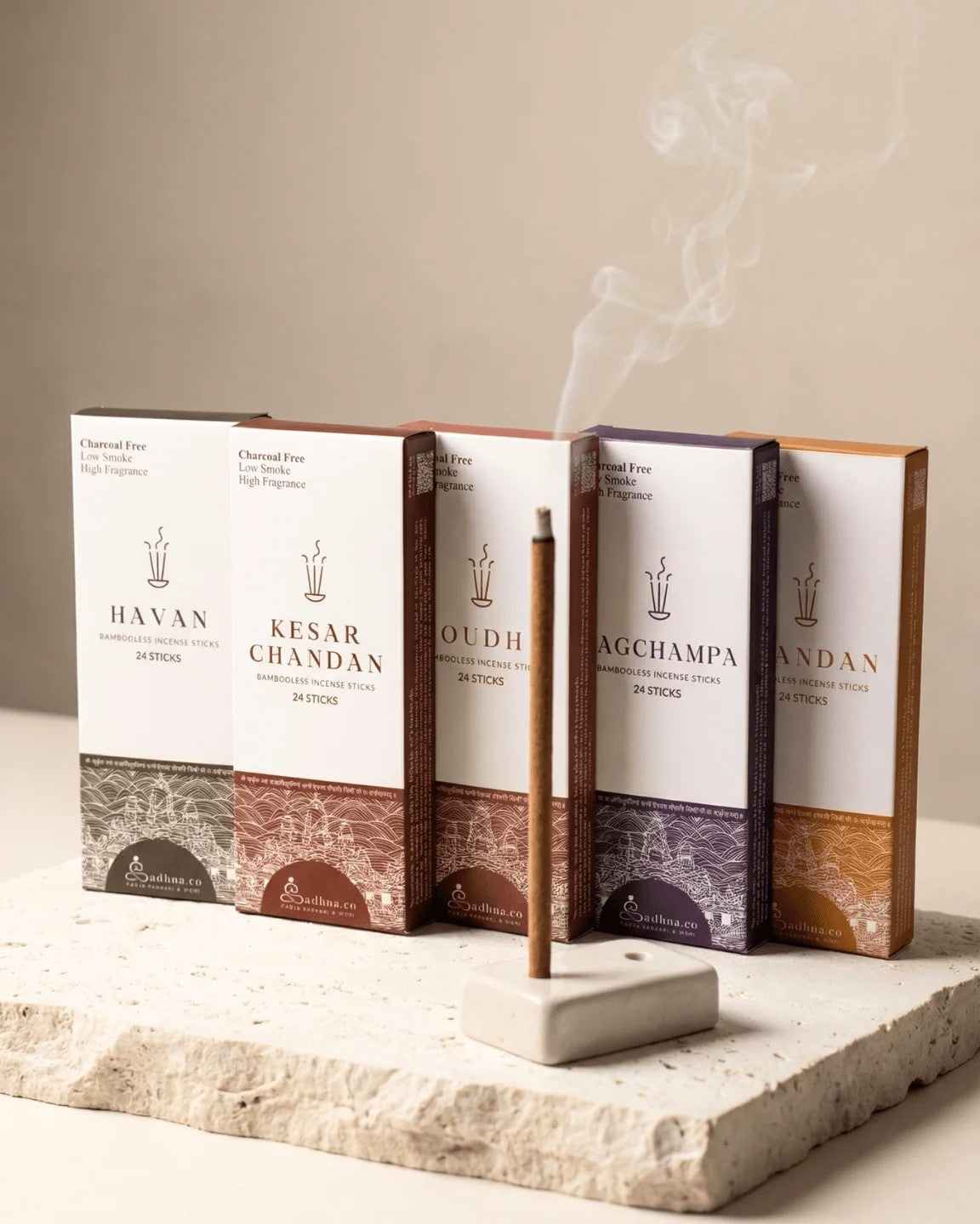 Five Sadhna trial packs with a lit incense stick